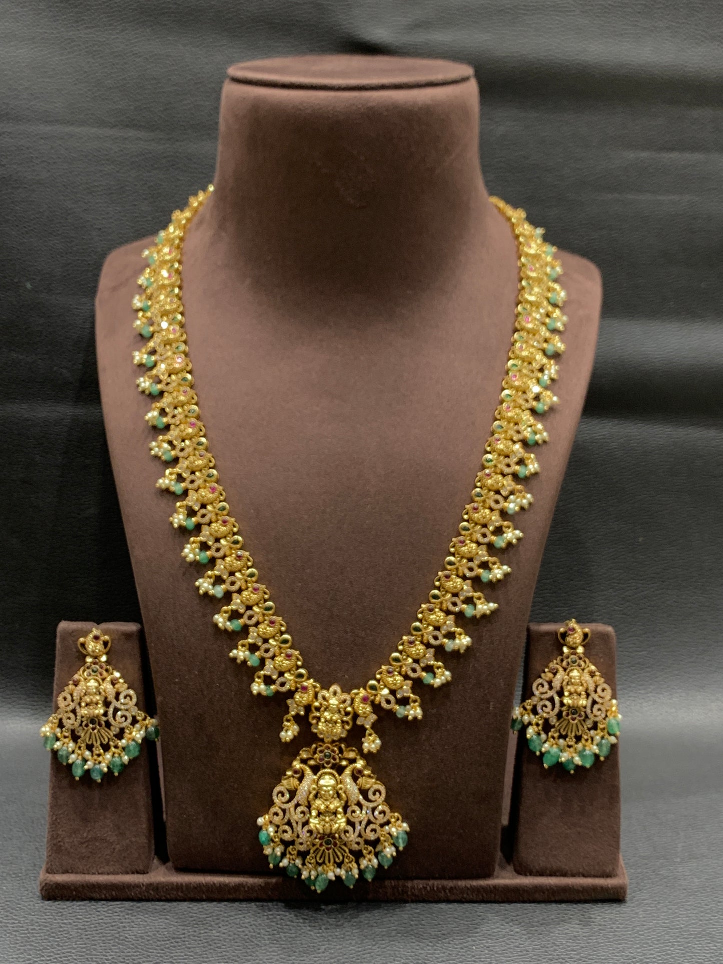 Golden necklace with silver stone