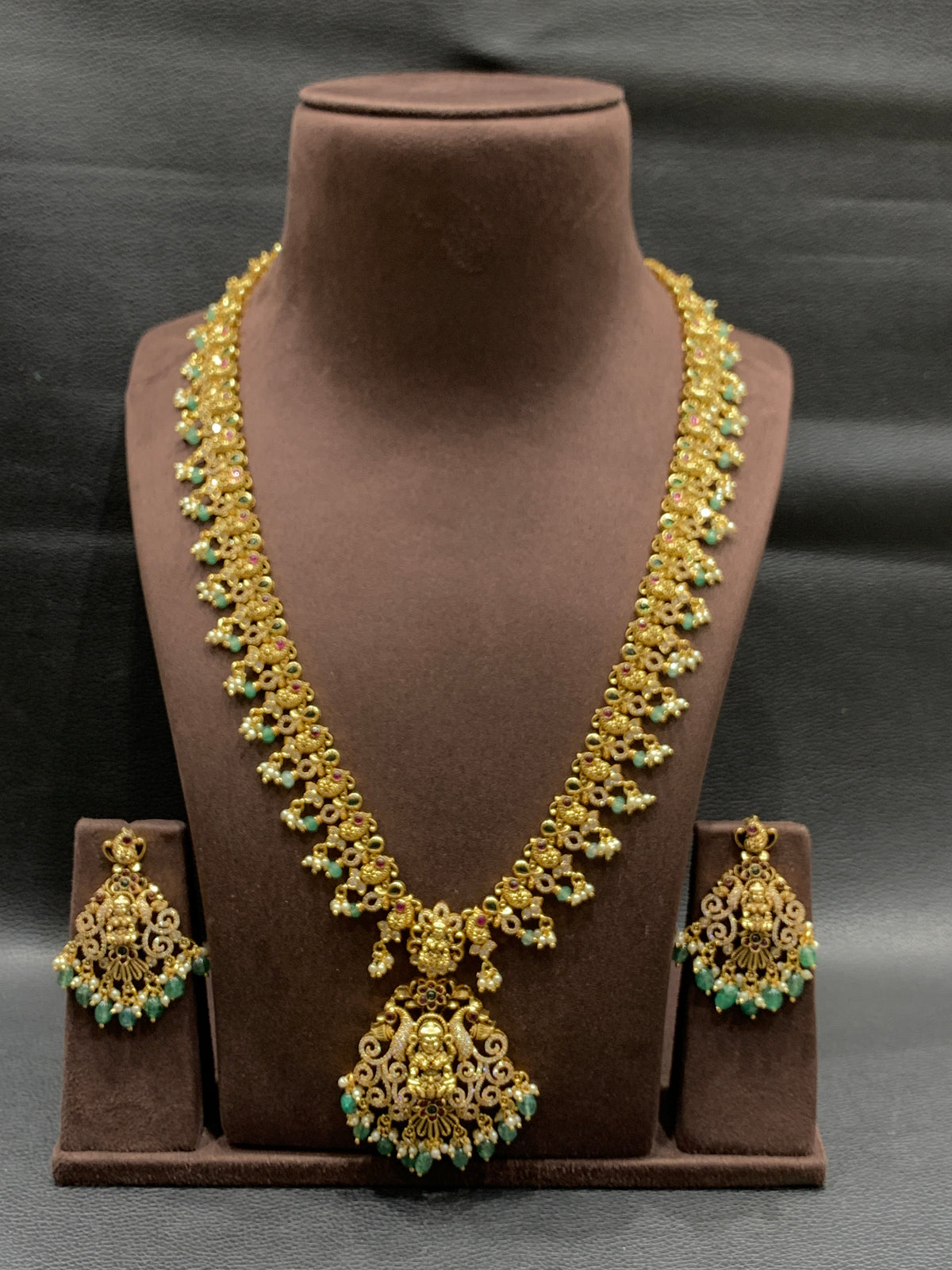 Golden necklace with silver stone