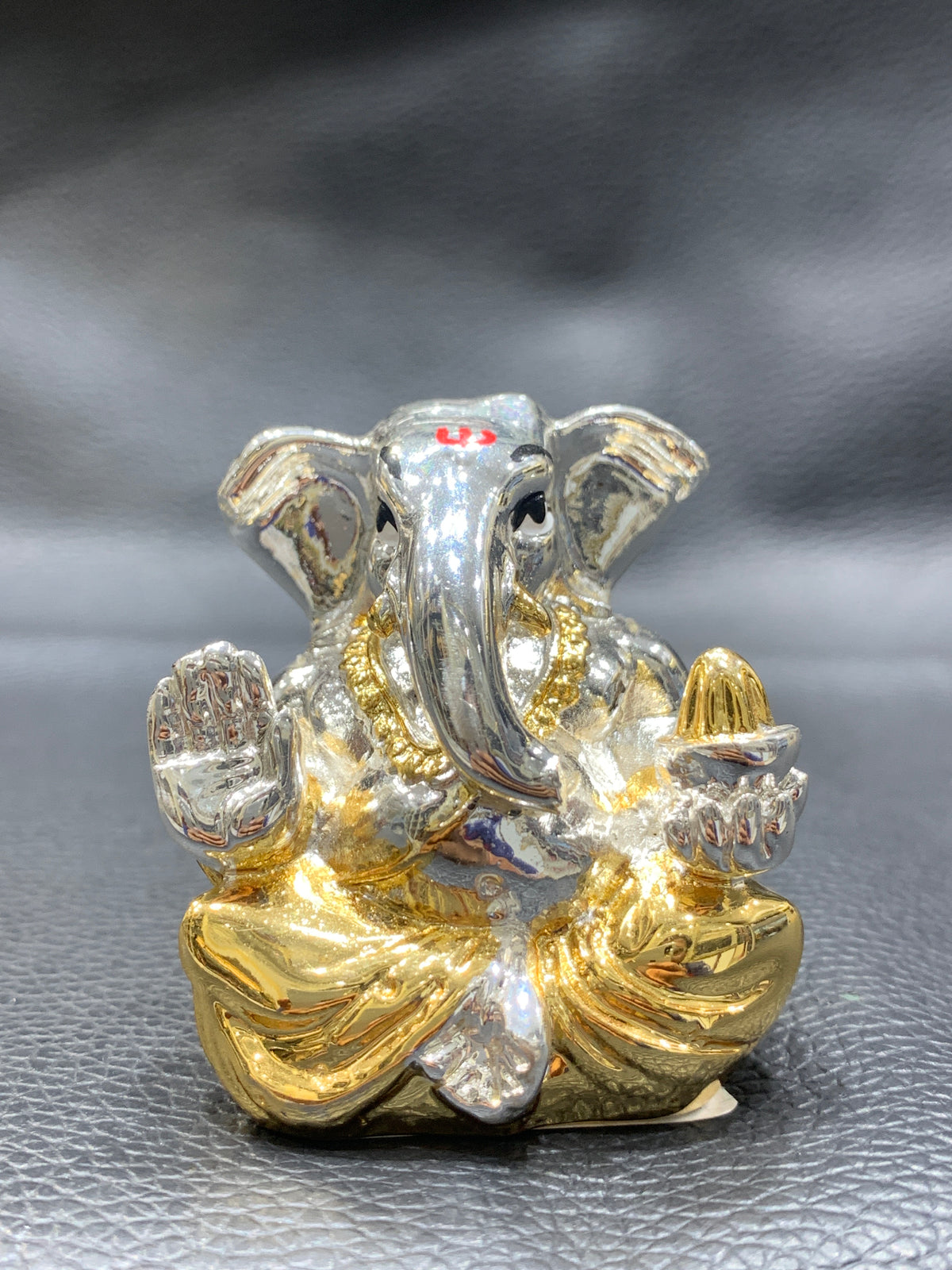 Gold sliver with gold dhoti